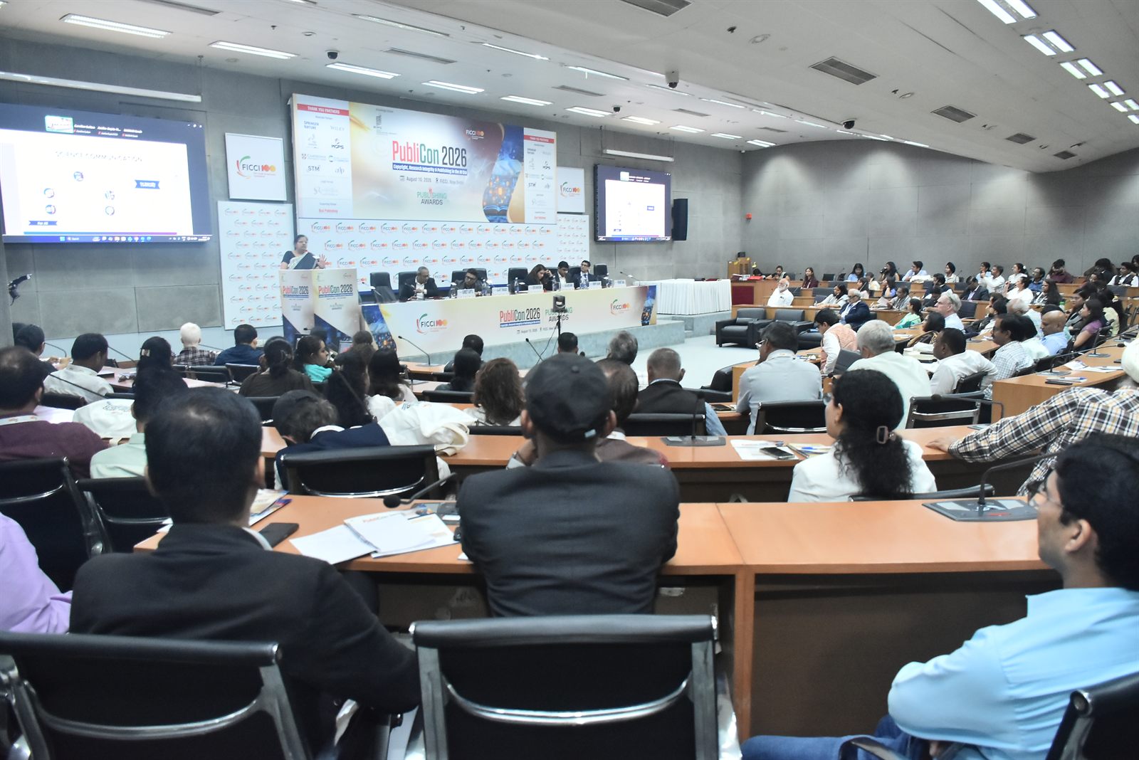 Delegates filling the conference hall during a session at PubliCon 2026, FICCI, New Delhi